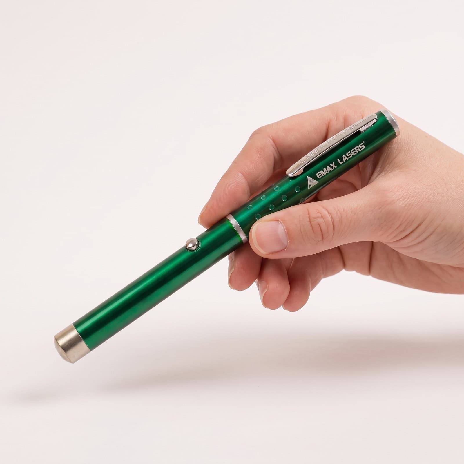 Emax green laser pointer held in the hand, to show the size
