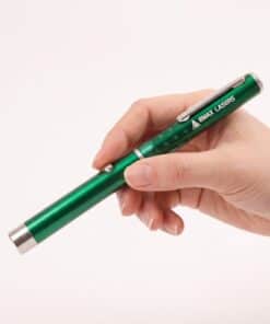 Emax green line laser held in the hand, to show the size