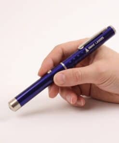 Emax purple laser pointer with five caps held in the hand, to show the size