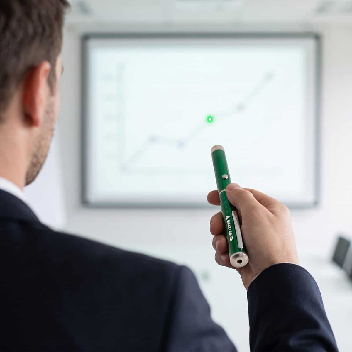 Emax green laser pointer used to point at a chart during a presentation